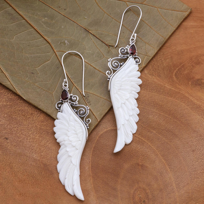 Garnet and bone dangle earrings, 'Caressed Wings' - Garnet and Bone Wing Dangle Earrings from Bali