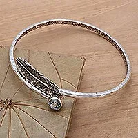 Blue topaz bangle bracelet, 'Sky Feather' - Handcrafted Sterling Silver Bangle Bracelet with Blue Topaz