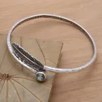 Blue topaz bangle bracelet, 'Sky Feather' - Handcrafted Sterling Silver Bangle Bracelet with Blue Topaz