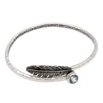 Blue topaz bangle bracelet, 'Sky Feather' - Handcrafted Sterling Silver Bangle Bracelet with Blue Topaz