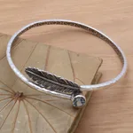 Blue topaz bangle bracelet, 'Sky Feather' - Handcrafted Sterling Silver Bangle Bracelet with Blue Topaz