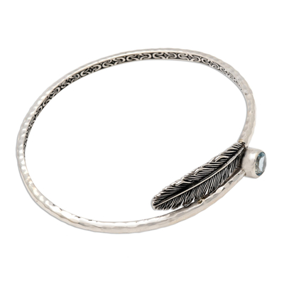 Blue topaz bangle bracelet, 'Sky Feather' - Handcrafted Sterling Silver Bangle Bracelet with Blue Topaz