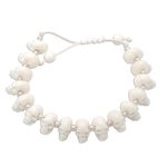 Bone beaded bracelet, 'Bone Collector' - Hand Carved Bone Skull Bead Bracelet