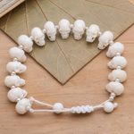 Bone beaded bracelet, 'Bone Collector' - Hand Carved Bone Skull Bead Bracelet