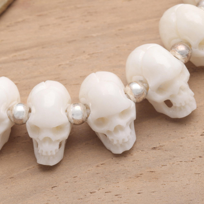 Bone beaded bracelet, 'Bone Collector' - Hand Carved Bone Skull Bead Bracelet