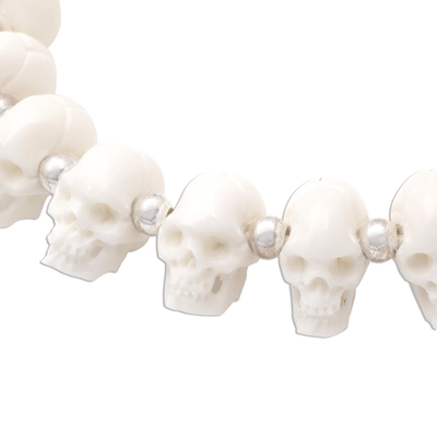 Bone beaded bracelet, 'Bone Collector' - Hand Carved Bone Skull Bead Bracelet