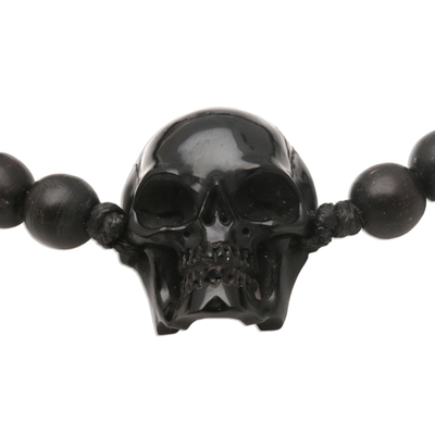 Beaded horn and wood pendant bracelet, 'Dark Visage' - Black Horn Skull Beaded Pendant Bracelet