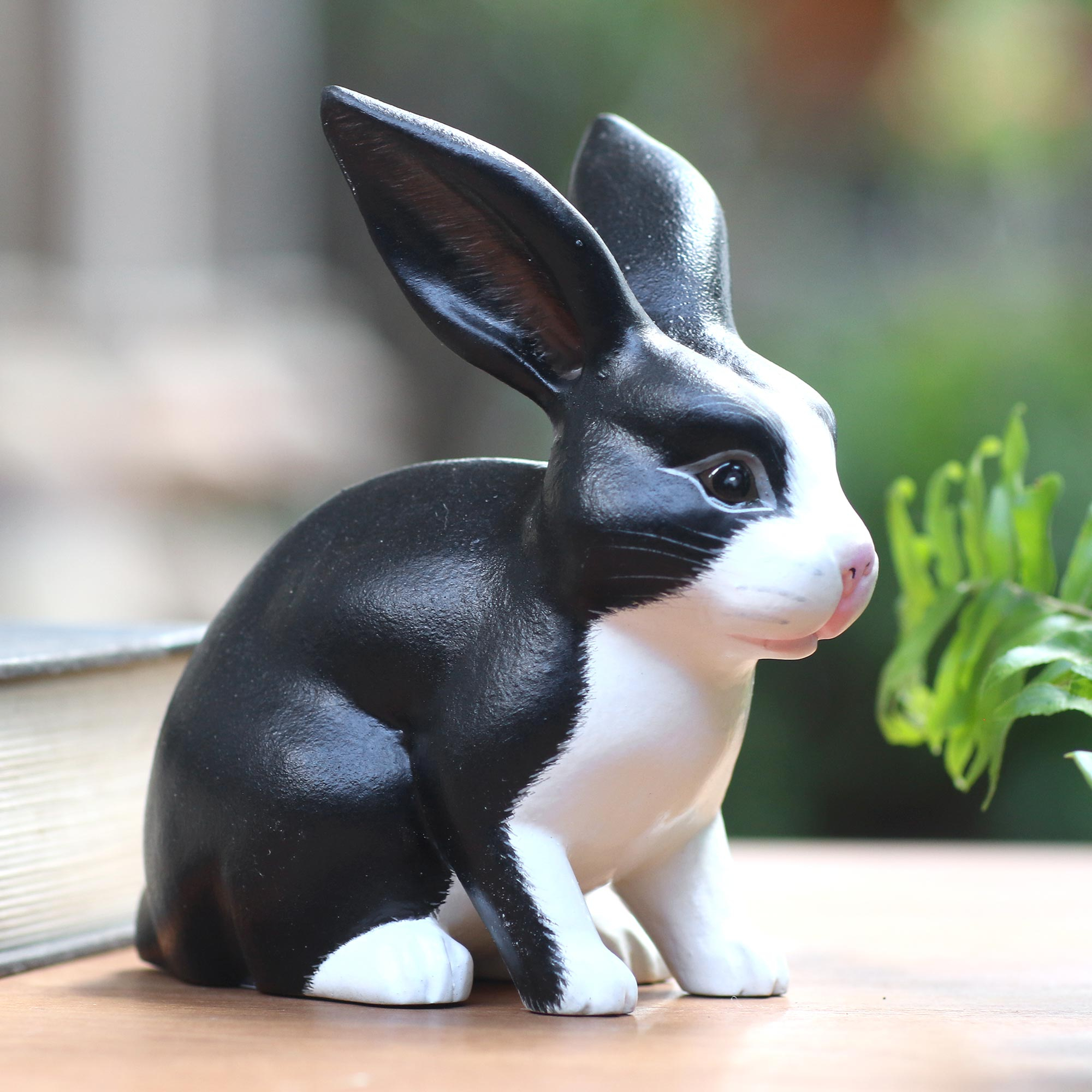 Balinese Signed Black And White Dutch Rabbit Wood Sculpture Inquisitive Dutch Rabbit Novica