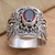Gold accent garnet cocktail ring, 'Oval Crimson Glow' - Balinese Silver and Oval Garnet Ring with Gold Accents (image 2b) thumbail