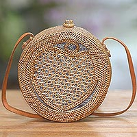 Round woven bamboo and ate grass shoulder bag, 'Heart's Delight in Brown' - Round Woven Bamboo Shoulder Bag with Heart Motif