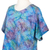 Hi-Low-Bluse aus Viskose - Mehrfarbige Batikbluse aus Rayon mit hohem, seitlichem Schwanz
