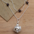Garnet and peridot harmony ball long necklace, 'Plumeria Chime' - Silver & Garnet Plumeria Harmony Ball Necklace with Peridot (image 2b) thumbail