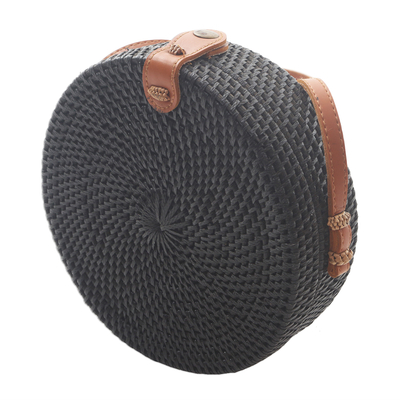 Bamboo shoulder bag, 'Midnight Lombok Circle' - Handwoven Black Bamboo Shoulder Bag with Faux Leather Strap