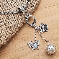 Rainbow moonstone harmony ball necklace, 'Butterfly Blessing' - Butterfly and Flower Rainbow Moonstone Harmony Ball Necklace