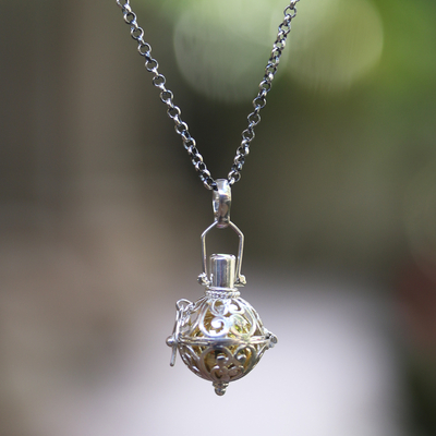 Garnet harmony ball necklace, 'Light of My Life' - Silver and Brass Harmony Ball Necklace with Garnet