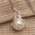 Blue topaz harmony ball necklace, 'Sweet Chime' - Silver and Brass Harmony Ball Necklace with Blue Topaz (image 2) thumbail