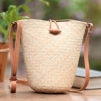 Leather accent rattan sling bag, 'Rattan Chic' - Handwoven Beige Rattan Sling Bag with Brown Leather Trim