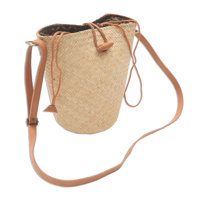 Leather accent rattan sling bag, 'Rattan Chic' - Handwoven Beige Rattan Sling Bag with Brown Leather Trim