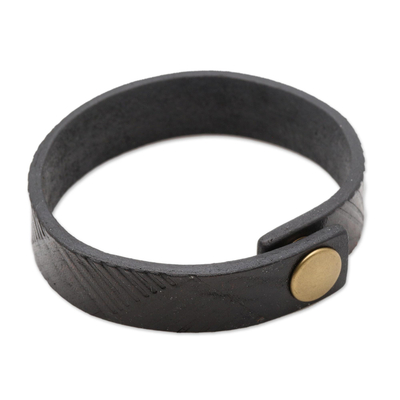 Leather wristband bracelet, 'Moving Mountains' - Balinese Embossed Motif Black Leather Bracelet