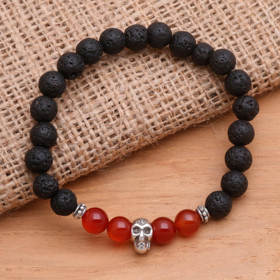 Lava stone and carnelian beaded stretch bracelet, 'Staring Skull in Scarlet' - Skull Pendant Carnelian and Lava Stone Beaded Bracelet