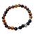 Tiger's eye and onyx beaded stretch bracelet, 'Staring Skull in Brown' - Tiger's Eye Stretch Beaded Bracelet with Sterling Skull