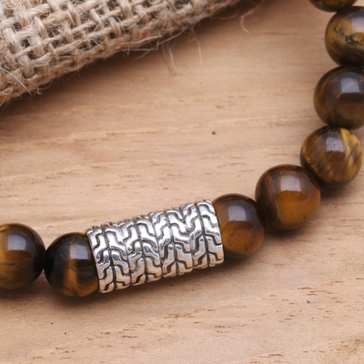 Tiger's eye and sterling silver beaded stretch bracelet, 'Flow Direction in Brown' - Sterling Silver Pendant Bracelet with Tiger's Eye Beads