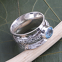 Blue topaz meditation spinner ring, 'Protected Beauty' - Blue Topaz and Sterling Silver Spinner Ring