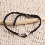 Sterling Silver and obsidian unity bracelet, 'Silver Handshake' - Bali Obsidian and Sterling Silver Cord Unity Bracelet