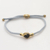 Brass and black agate unity bracelet, 'Golden Grey Handshake' - Bali Brass and Black Agate Grey Cord Unity Bracelet (image 2) thumbail