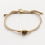 Brass and tiger's eye unity bracelet, 'Golden Handshake' - Bali Brass and Tiger's Eye Beige Cord Unity Bracelet (image 2) thumbail