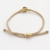 Brass and tiger's eye unity bracelet, 'Golden Handshake' - Bali Brass and Tiger's Eye Beige Cord Unity Bracelet (image 2c) thumbail