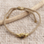 Brass and tiger's eye unity bracelet, 'Golden Handshake' - Bali Brass and Tiger's Eye Beige Cord Unity Bracelet (image 2d) thumbail