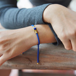 Brass and blue agate unity bracelet, 'Golden Hands' - Adjustable Unity Bracelet