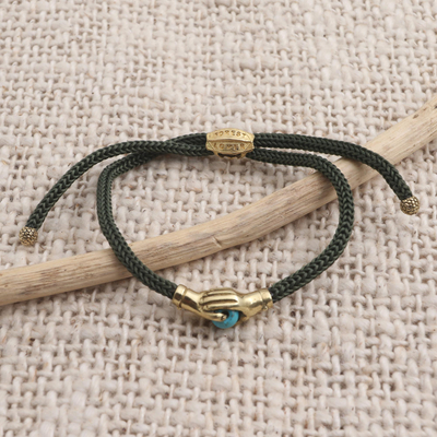 Brass unity bracelet, 'Golden Blue Handshake' - Bali Brass & Reconstituted Turquoise Cord Unity Bracelet