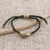 Brass unity bracelet, 'Golden Blue Handshake' - Bali Brass & Reconstituted Turquoise Cord Unity Bracelet (image 2d) thumbail