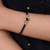 Brass and obsidian unity bracelet, 'Golden Handshake' - Brass and Black Obsidian Cord Unity Bracelet from Bali