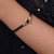 Brass and obsidian unity bracelet, 'Golden Handshake' - Brass and Black Obsidian Cord Unity Bracelet from Bali (image 2d) thumbail
