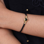 Brass and obsidian unity bracelet, 'Golden Handshake' - Brass and Black Obsidian Cord Unity Bracelet from Bali