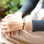 Brass and obsidian unity bracelet, 'Golden Handshake' - Brass and Black Obsidian Cord Unity Bracelet from Bali