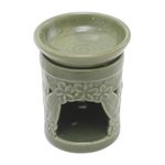 Ceramic oil warmer, 'Jepun Tree' - Floral Themed Handmade Ceramic Oil Warmer