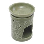 Ceramic oil warmer, 'Jepun Tree' - Floral Themed Handmade Ceramic Oil Warmer