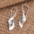 Blue topaz dangle earrings, 'Blue Shift' - Modern Silver and Blue Topaz Dangle Earrings thumbail