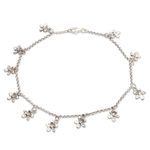 Sterling silver charm anklet, 'Glimmering Flowers' - Sterling Silver Floral Charm Anklet from Bali