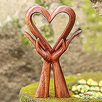 Featured review for Wood sculpture, Giving Love