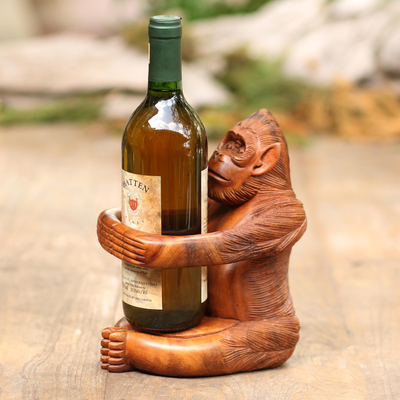 Wood wine holder, 'Monkey Hug' - Handmade Suar Wood Monkey Wine Holder