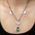 Labradorite and quartz pendant necklace, 'Candi' - Handmade Labradorite and Quartz Pendant Necklace