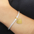 Gold-accented sterling silver charm bracelet, 'Love for Mom in Gold' - Gold-Plated Sterling Silver Heart Charm Bracelet from Bali (image 2d) thumbail