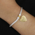 Gold-accented sterling silver charm bracelet, 'Golden Romance' - Hand Made Gold-Plated Heart Charm Bracelet from Bali