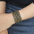 Hematite wrap bracelet, 'Golden City' - Artisan Crafted Hematite Wrap Bracelet from Bali