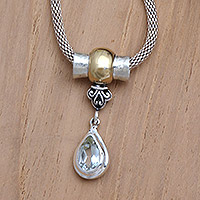 Gold-accented blue topaz pendant necklace, 'Sea Water' - Gold-Accented Sterling Silver and Blue Topaz Necklace